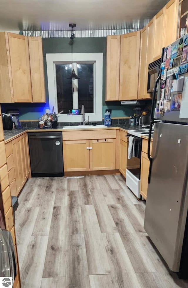 kitchen with sink, pendant lighting, light hardwood / wood-style floors, black appliances, and light brown cabinetry