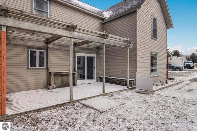 back of property with a pergola