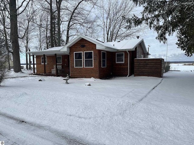 single story home featuring covered porch