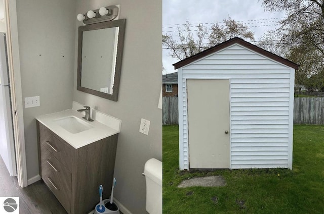 bathroom featuring toilet and vanity