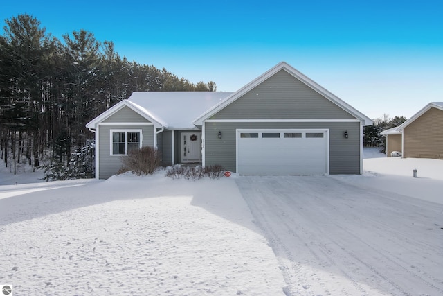 ranch-style home featuring a garage