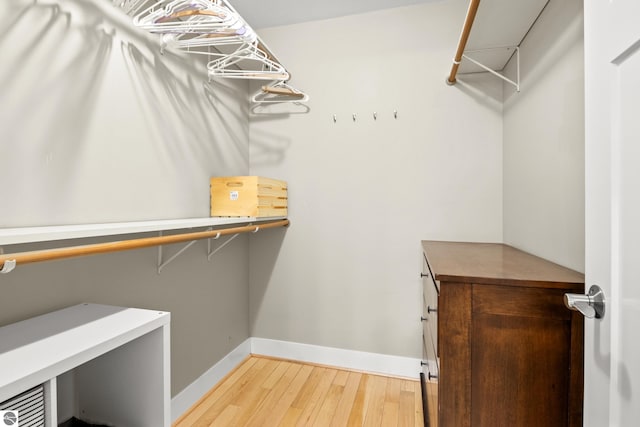 walk in closet featuring light wood-type flooring