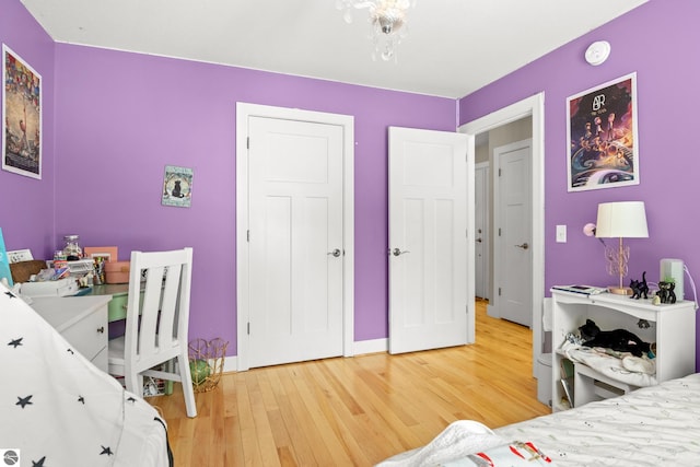 bedroom with hardwood / wood-style flooring