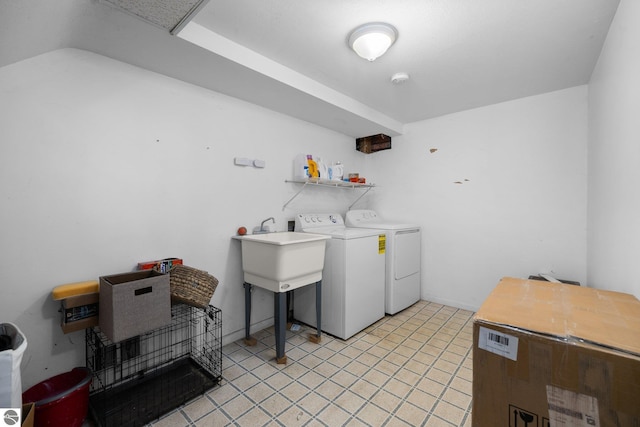 washroom featuring sink and washer and clothes dryer