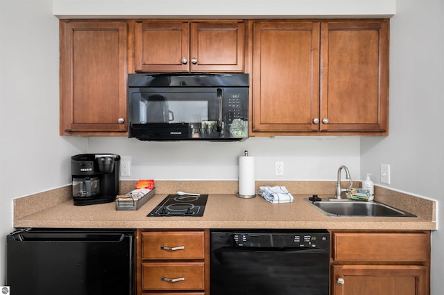 kitchen featuring black appliances and sink