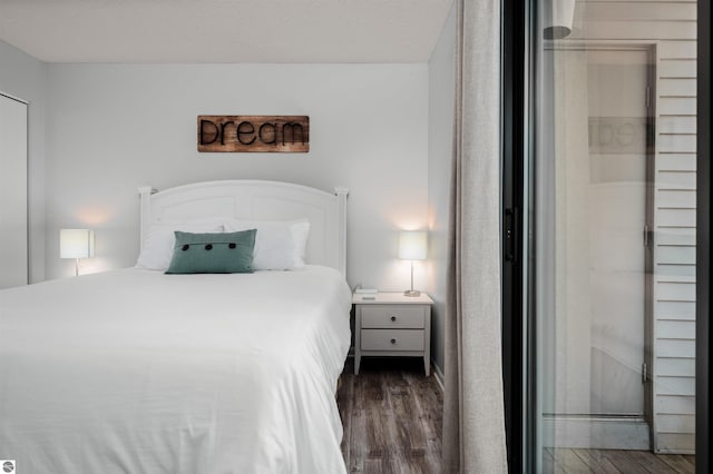 bedroom featuring dark hardwood / wood-style flooring