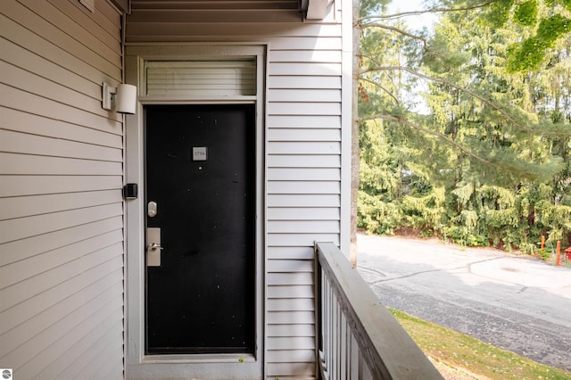 entrance to property with a balcony