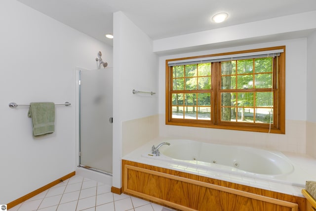 bathroom with tile patterned floors and plus walk in shower