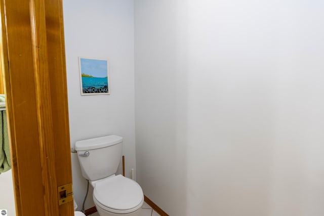 bathroom with tile patterned floors and toilet