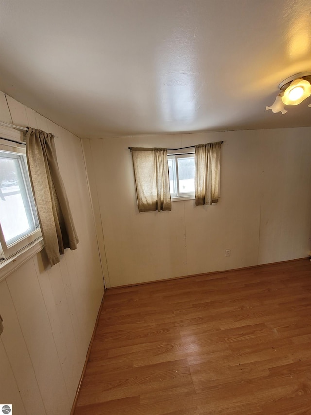 spare room with light hardwood / wood-style floors