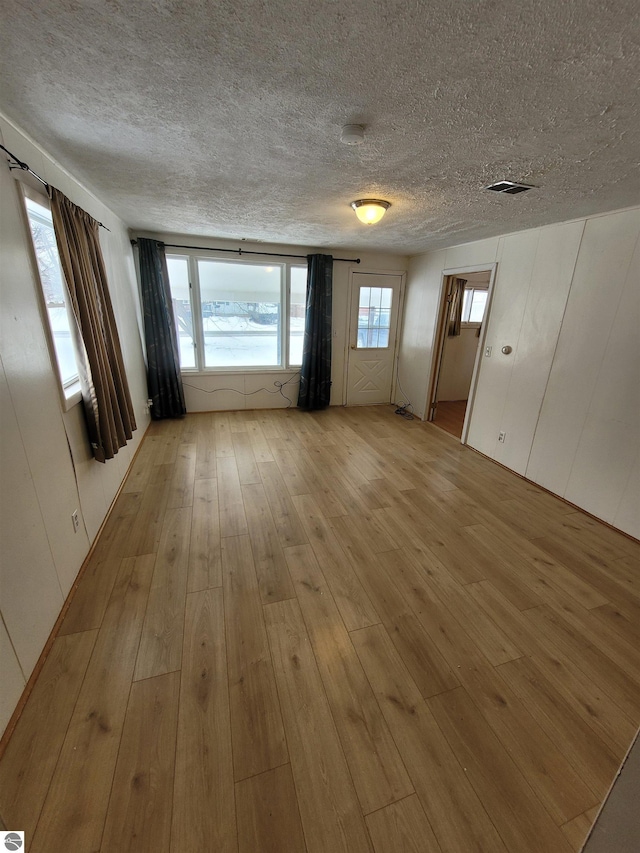 spare room featuring light hardwood / wood-style floors