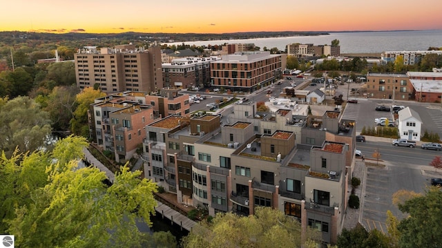 aerial view at dusk with a water view