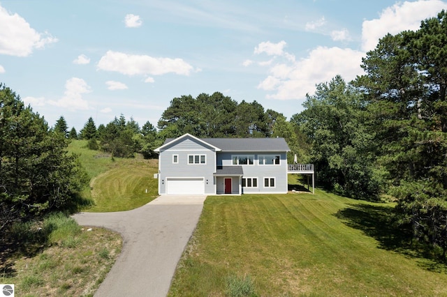 view of front facade featuring a front yard and a garage