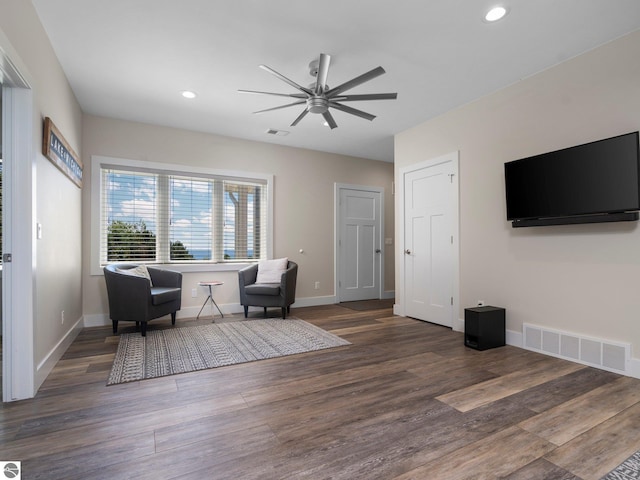 interior space featuring dark wood-type flooring and ceiling fan