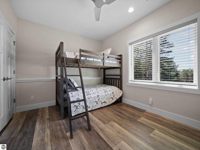 bedroom featuring ceiling fan and dark hardwood / wood-style floors