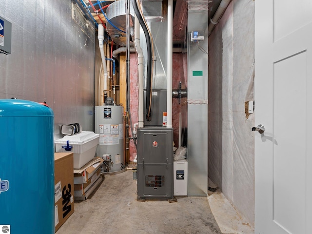 utility room featuring water heater