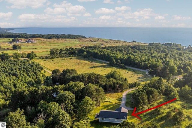 birds eye view of property with a water view and a rural view