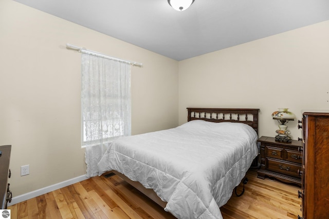 bedroom featuring light wood-type flooring