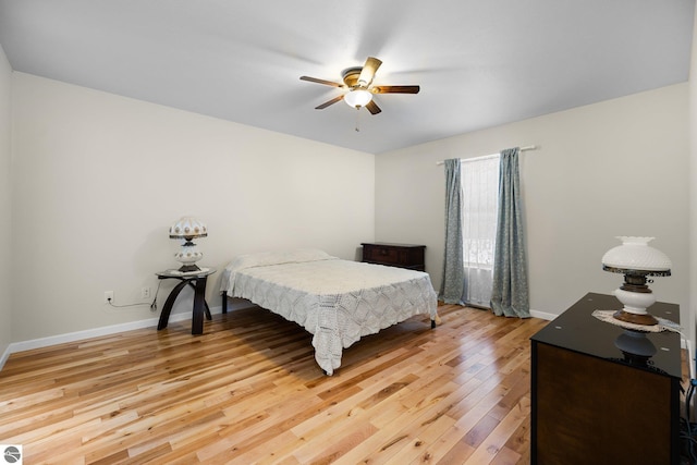 bedroom with hardwood / wood-style floors and ceiling fan