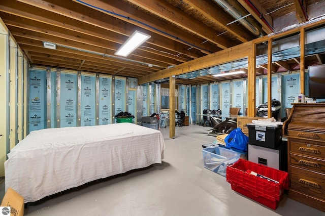 bedroom featuring concrete flooring