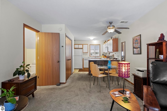 living room featuring light colored carpet and ceiling fan