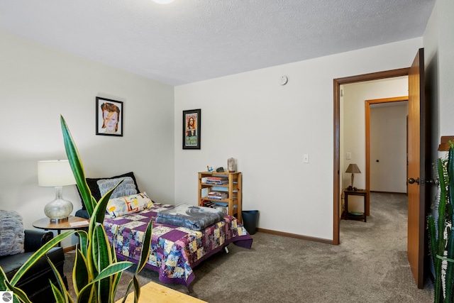 carpeted bedroom featuring a textured ceiling