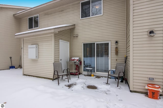 view of snow covered property