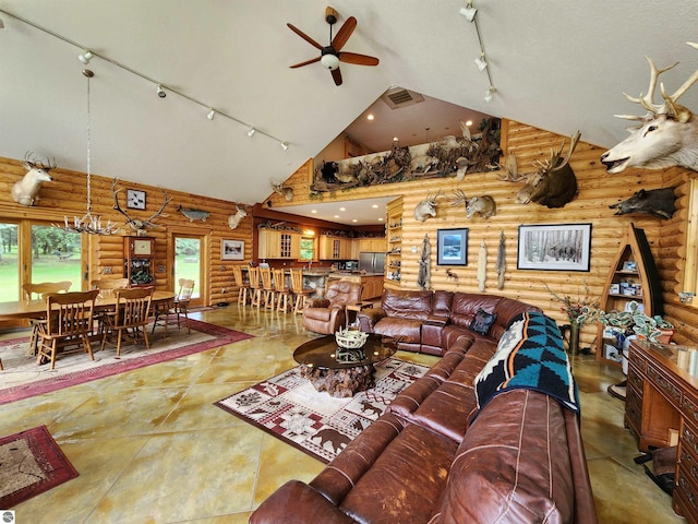 living room with rustic walls, ceiling fan, track lighting, and high vaulted ceiling