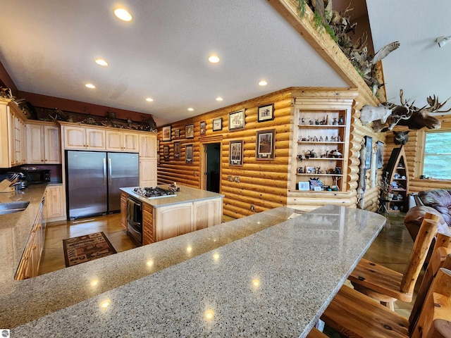 kitchen with light stone countertops, stainless steel appliances, a kitchen island, and a kitchen breakfast bar