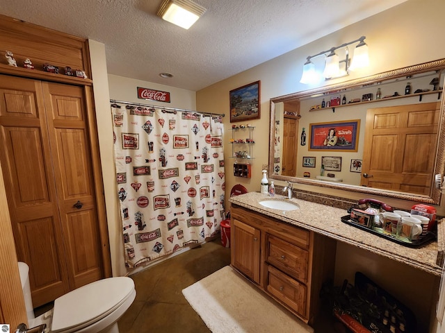 bathroom featuring a textured ceiling, a shower with shower curtain, toilet, tile patterned floors, and vanity