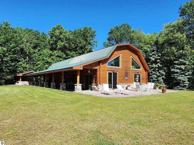 back of property with a patio and a yard