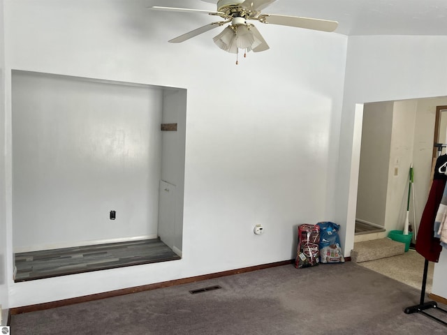 interior space featuring ceiling fan and carpet floors