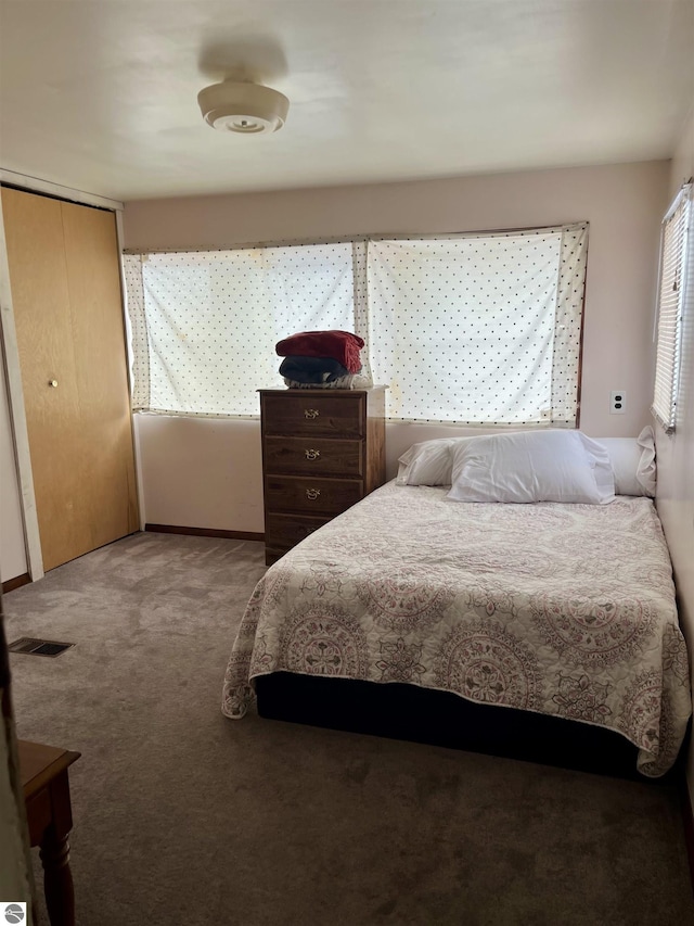 bedroom featuring a closet and carpet