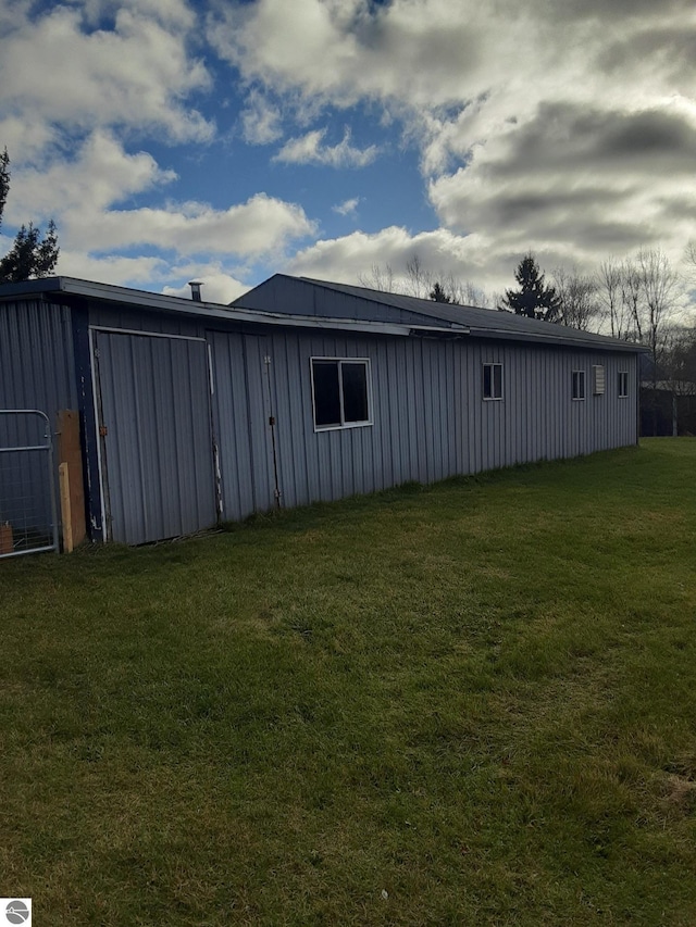 view of property exterior with a yard