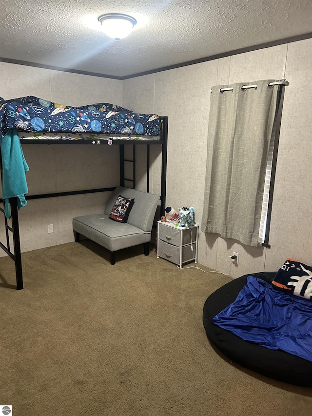 carpeted bedroom featuring a textured ceiling