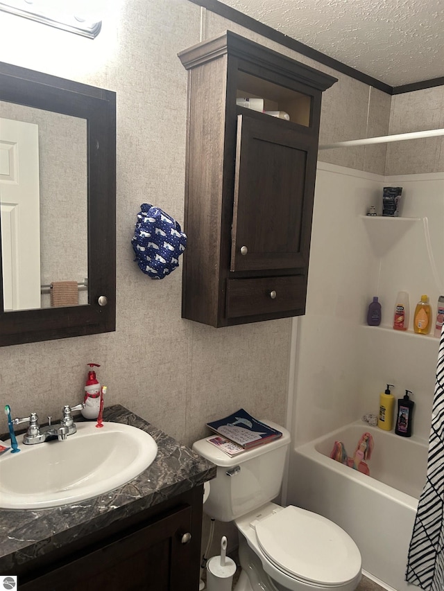 full bathroom with a textured ceiling, shower / bath combination with curtain, vanity, and toilet