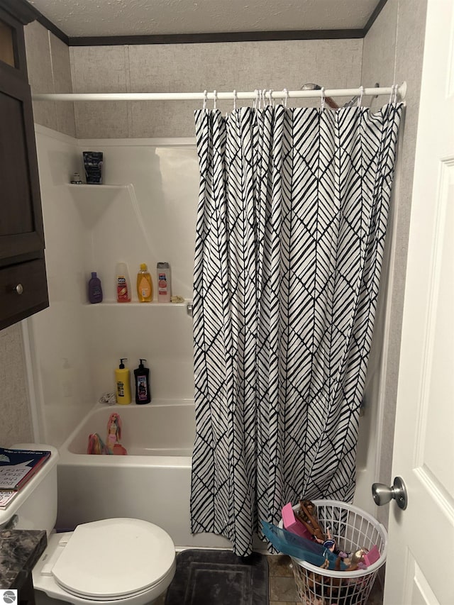 bathroom with shower / bath combination with curtain and toilet