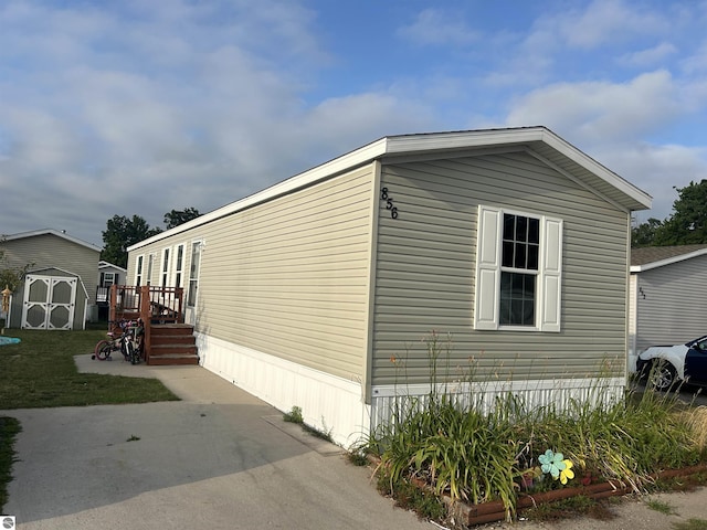 view of property exterior featuring a shed