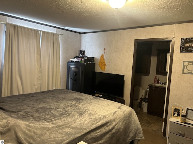 bedroom with a textured ceiling and ornamental molding