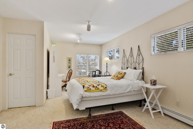 carpeted bedroom with baseboard heating