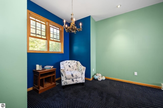 sitting room featuring carpet floors and a notable chandelier