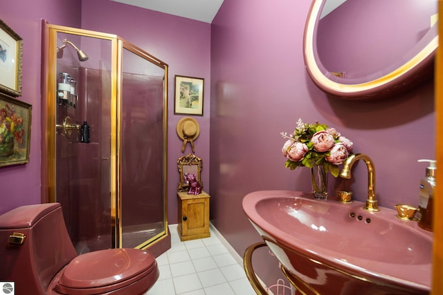 bathroom featuring toilet, tile patterned flooring, a shower with door, and sink