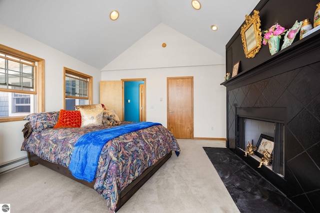 bedroom featuring lofted ceiling, a baseboard radiator, and carpet flooring