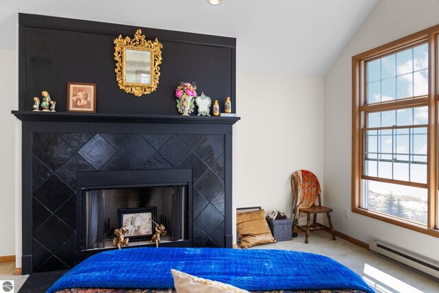 room details featuring carpet flooring, baseboard heating, and a tile fireplace