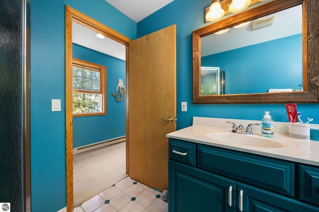 bathroom featuring tile patterned floors, a baseboard radiator, and vanity