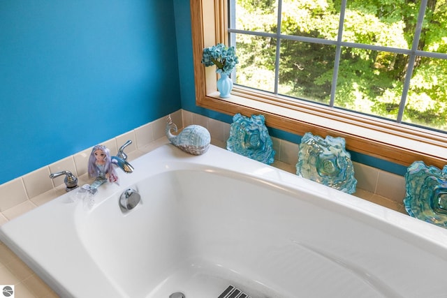 bathroom with a tub to relax in