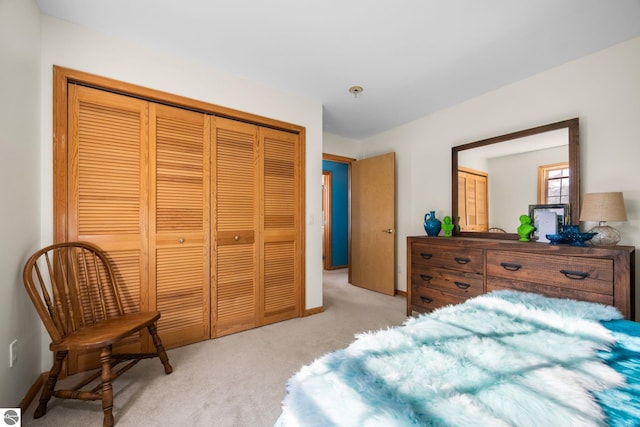 carpeted bedroom with a closet