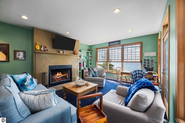 living room with a tiled fireplace