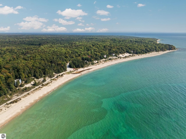 birds eye view of property featuring a water view and a view of the beach