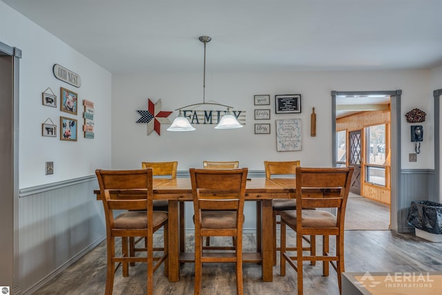 dining area with dark hardwood / wood-style floors